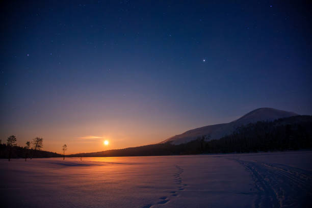 istock Sunset Sun and Starry Sky over Northern Landscape 2187305322