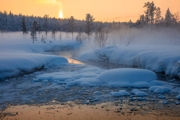 istock Fog at Sunset over Snowy Forest and River 2187305350