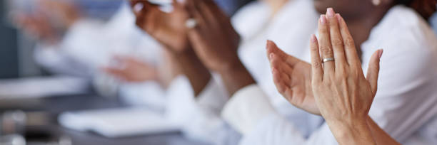 istock Header Image of Female Doctor Clapping Hands Supporting Coworkers Speech at Working Meeting Indoors 2187306139