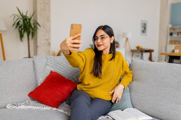 istock Young woman captured in a relaxed home setting. 2187306763