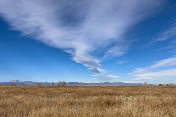 istock Autumn Meadow, Lenticular Clouds and Rocky Mountains 2187308749