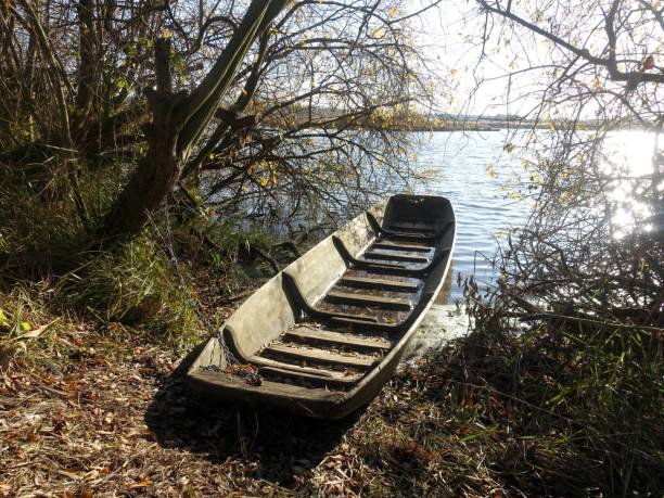 Old-fashioned fishing river boat floating on the river surface