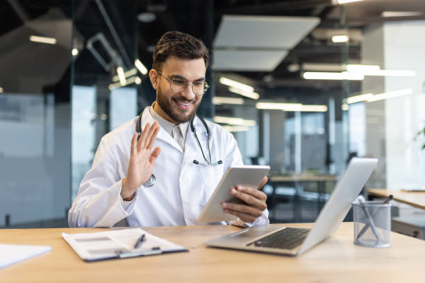 istock Confident doctor conducting an online consultation using smartphone technology in a modern office setting 2187309111