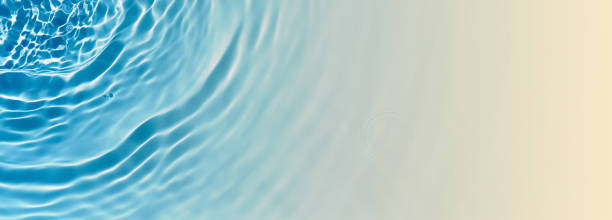 istock abstract blue water wave at the sunny sand beach from above, empty beach holiday beackground banner concept with copy space for travel, vacations and beauty care spa outdoors 2187312268