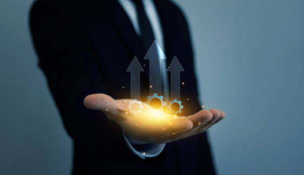 istock Businessman holding productivity arrow growth graph for efficient process.Business process to increase productivity concept 2187313940
