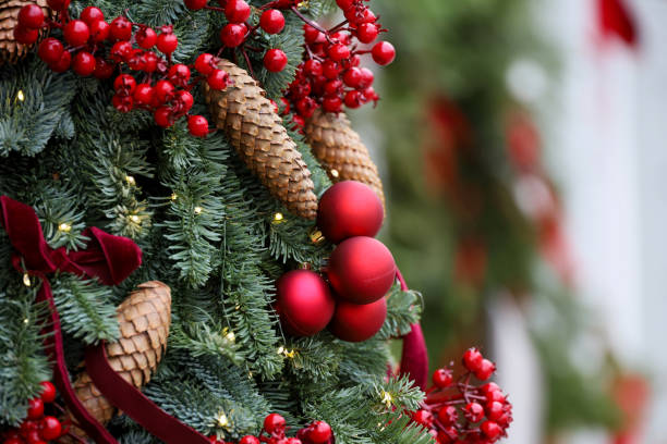 istock Christmas tree branches with red balls and cones 2187314729