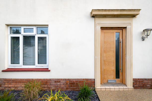 Oak door and a window, front of a house
