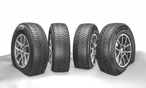 istock Four snow-covered winter tires standing 2187318860
