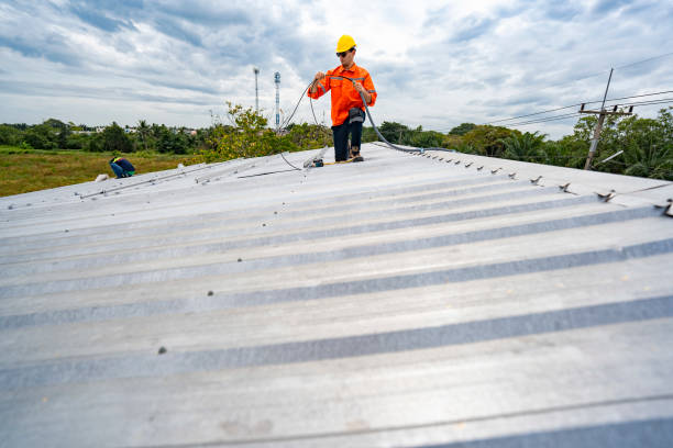 istock Technician in safety uniform and helmet kneeling on a rooftop, using a drill for precise installation work. A scene highlighting safety, professionalism, and technical expertise in construction. 2187318990