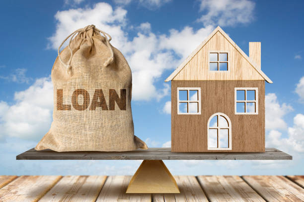 istock REAL ESTATE AND HOME LOAN CONCEPT WITH HOUSE MODEL - Building activity and construction industry saving and investment 2187320771