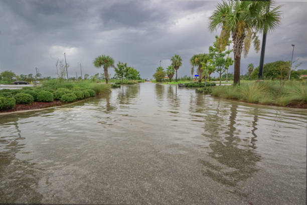 istock A parking lot submerged under heavy rain, with water pooling  creating  stormy scene. 2187323890