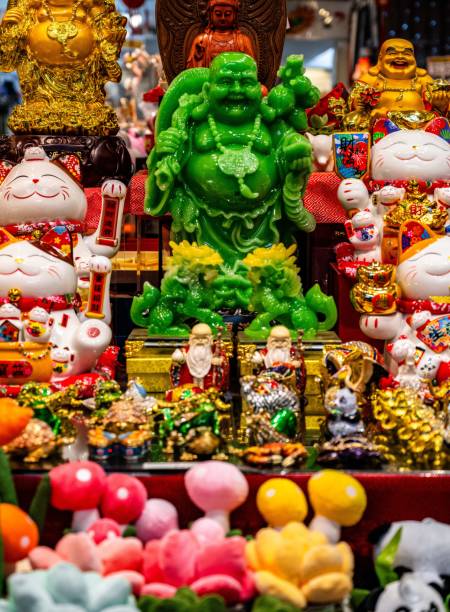 istock Asian cultural figurines display in vibrant market. 2187324059