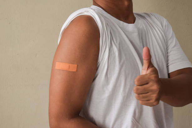 istock Man Got the immunity vaccine on gray background 2187327591