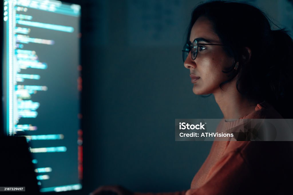 Focused Hispanic Latin Female Programmer Working On Code At Night In A ...