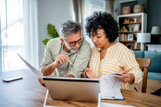 istock Mature couple manages home finances 2187329889