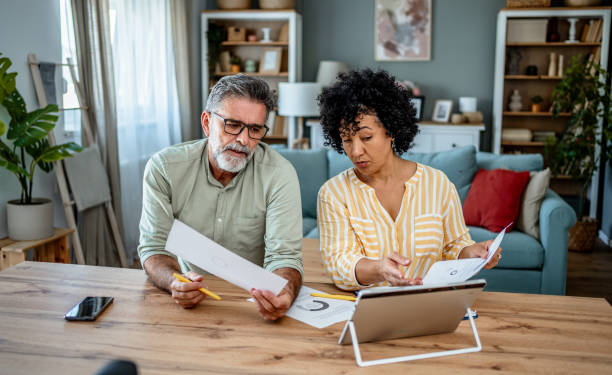 istock Mature couple manages home finances 2187330029
