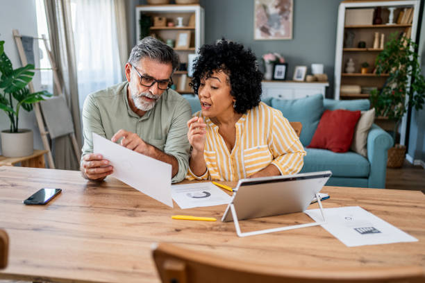 istock Mature couple manages expenses and bills 2187330113