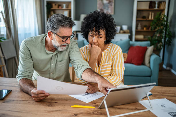 istock Mature couple manages home finances 2187330836
