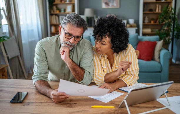 istock Mature couple manages home finances 2187330873