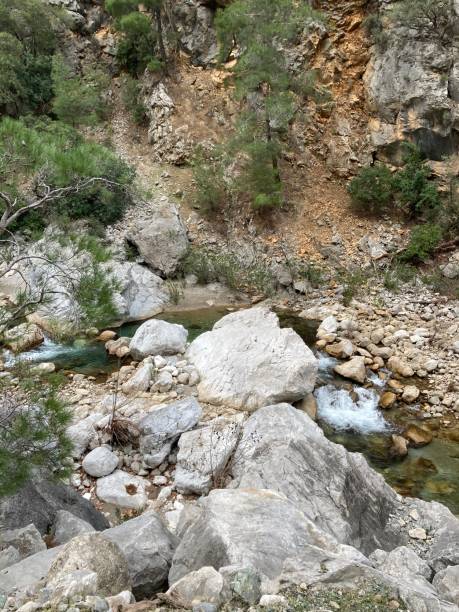 istock A small crystal clear mountain river flows among the stones, finding its way 2187331115