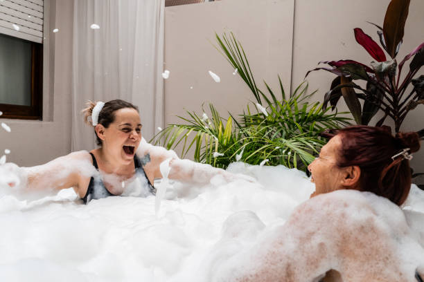 istock Friends having fun on bathtub of the spa 2187337382