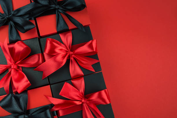 istock Top view photo of gift boxes with bow on isolated red background. 2187339616