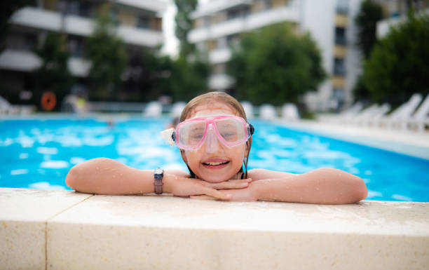 Portrait of a beautiful and happy teenage girl with Down syndrome in a swimming pool - Buenos Aires - Argentina