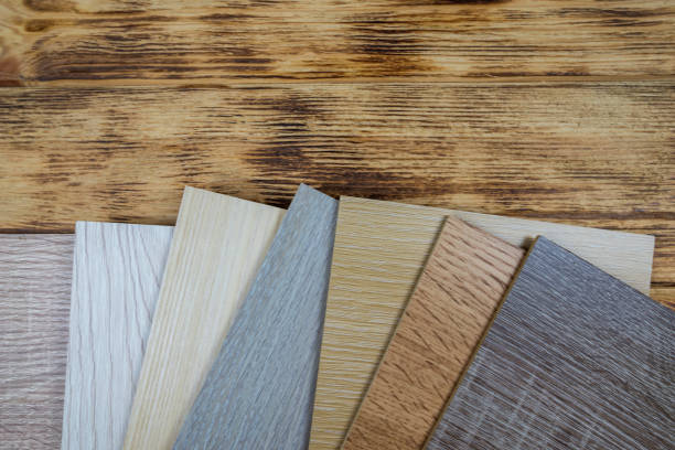 istock wooden premium sampler for design of modern apartments.Laminate background. Samples of laminate or parquet with a pattern and wood texture for flooring and interior design. Production of wooden floors 2187340387