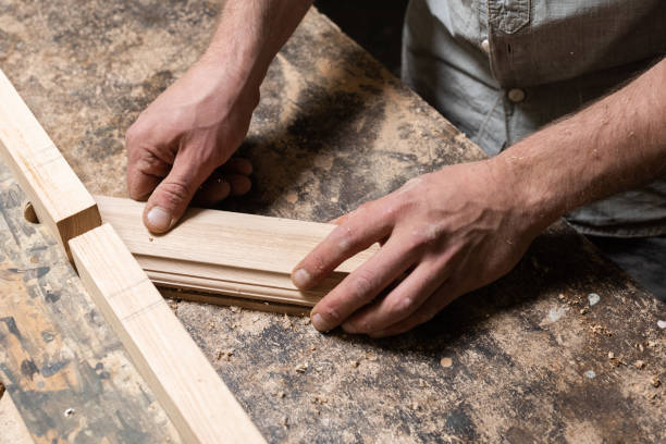 istock A carpenter is milling a part on a homemade machine 2187340964