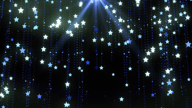 istock Christmas background with star particles and lights falling in line on blue 2187341249