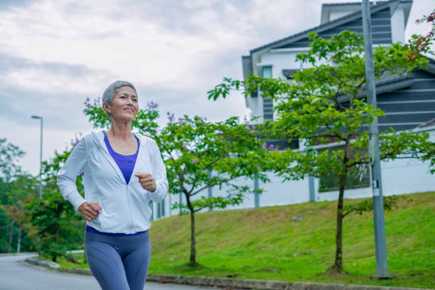 istock senior woman jogging on trail 2187341392