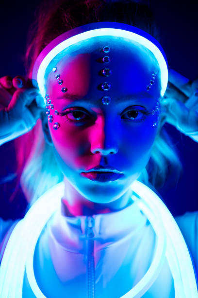 istock Stunning lady touch wear neon glitter cable crown looking over augmented colorful fluorescent background 2187342207