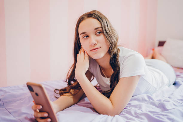 istock Teenager girl using phone 2187342936
