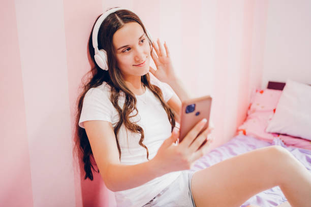 istock Teenager girl using phone 2187343130