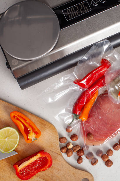 istock Vacuum Sealer with Fresh Vegetables and Meat 2187343360