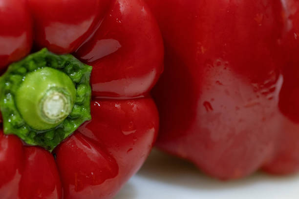 Paprika is an annual plant from the nightshade family.  The fruit is a short oval shape with a large, flat top, and the bottom is concave and has vertical valleys.