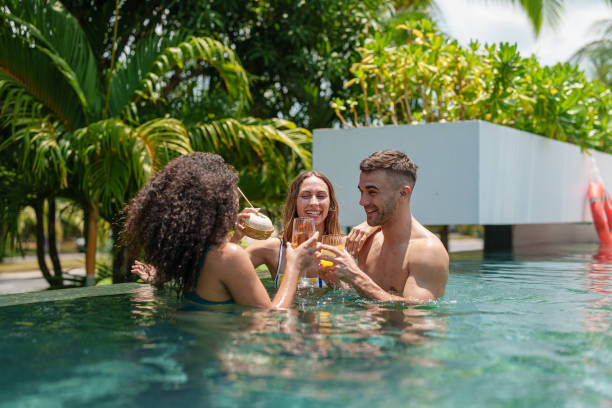 istock Joyful Multiracial Friends Socializing in Swimming Pool 2187345709