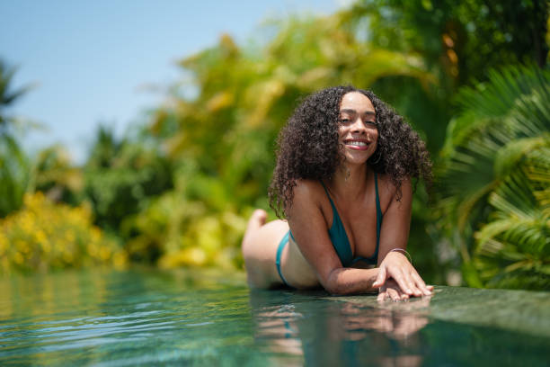 istock Cheerful Young Woman by Poolside 2187345774