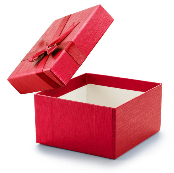 istock Opened empty red gift box and lid with satin bow floating above it isolated on white background. File contains clipping path. 2187346350