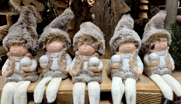 istock figures of winter characters sitting in a row. 2187348549