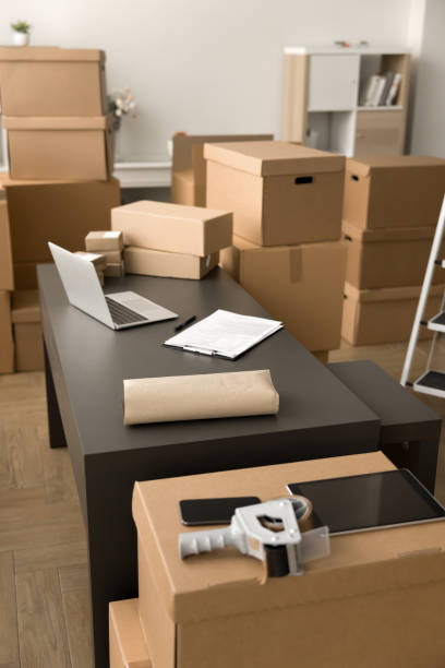 istock Online shop storage office table with laptop, boxes for shipping, 2187348625