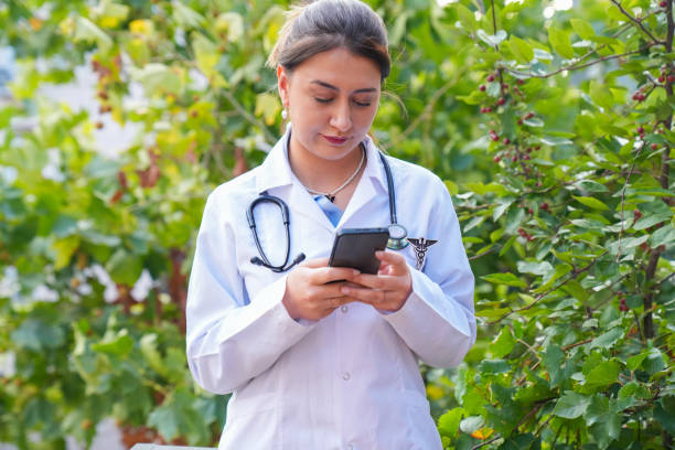 istock Doctor texting on the phone during break 2187349920
