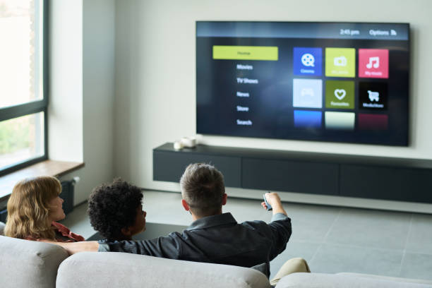 istock Watching TV Together in Modern Living Room Setting 2187351203