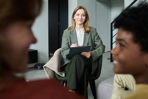 istock Smiling Professional Holding Tablet During Business Meeting 2187351216