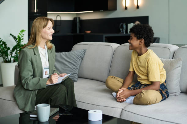 istock Smiling Therapist Engaging with Happy Young Patient 2187351223