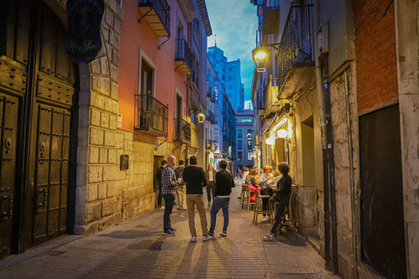 Octubre, 2024. Valladolid, Spain. A street with a bar terrace and some people enjpying the evening.
