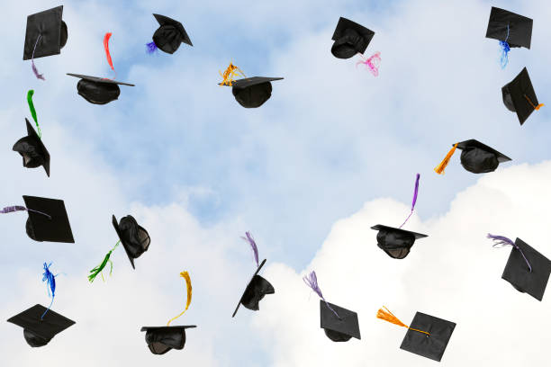 istock Graduation caps thrown in the sky 2187355199