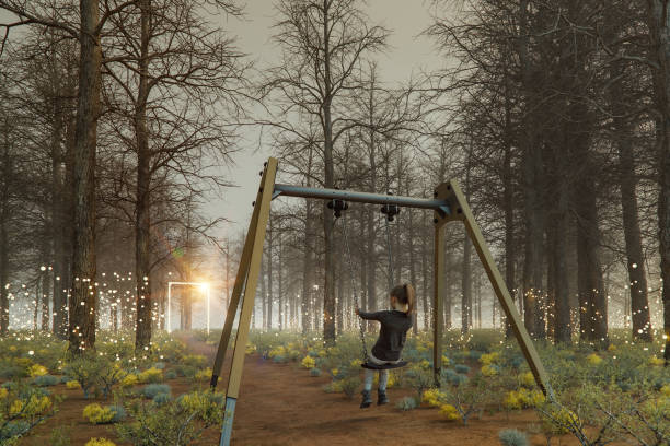 istock Young kid on a swing imagining things on the playground 2187361388