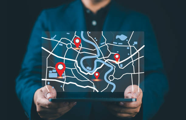 istock GPS location system. Businessman marks location points and search addresses on geolocation map application. Pin destination for travel or finding business places in GPS Satellite coordinates system. 2187363196