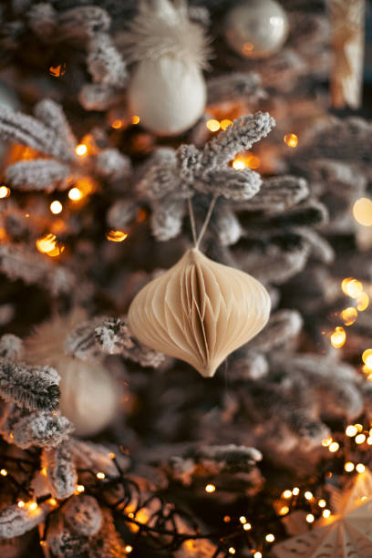 istock Snow-covered Christmas tree with Christmas tree decorations close-up. Christmas and New Year holidays. Bokeh, blurred background 2187364881
